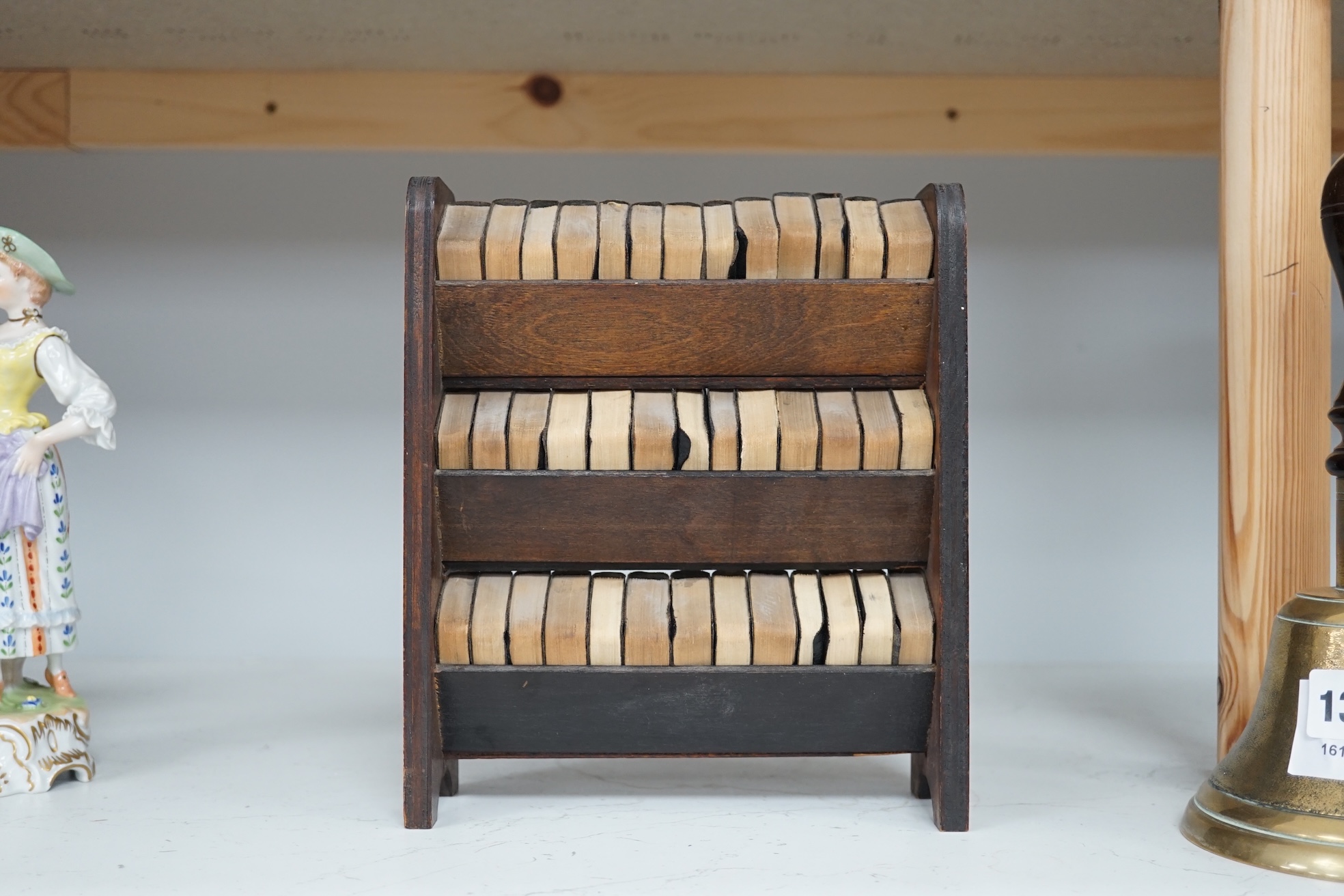 Miniature printing - The Works of Shakespeare, 40 vols, each 3.5 x 5cms, The Allied Press Newspaper, c. 1932, in custom made miniature plywood bookcase, 22.5cm high. Condition - fair to good.